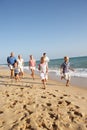 Portrait Of Three Generation Family On Beach