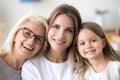 Portrait of three generations family, grandmother, grown daughte Royalty Free Stock Photo