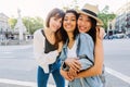 Portrait of three group of diverse young girls standing at city street Royalty Free Stock Photo