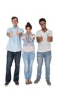 Portrait of three happy friends gesturing thumbs up Royalty Free Stock Photo