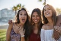 Three happy women standing together pulling faces Royalty Free Stock Photo