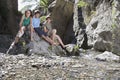 Portrait Of three Kids Sitting On Rock Royalty Free Stock Photo