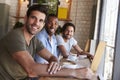 Portrait Of Three Male Friends Meeting In Coffee Shop Royalty Free Stock Photo