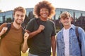 Portrait Of Three Male University Or College Student Standing Outdoors By Modern Campus Building Royalty Free Stock Photo