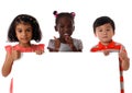 Portrait three of multiracial kids in studio with white board.Isolated Royalty Free Stock Photo