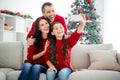 Portrait of three nice attractive lovely positive cheerful cheery adorable dreamy family sitting on divan taking making Royalty Free Stock Photo