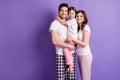 Portrait of three person cheerful careful loving family mom dad offspring daughter wearing cozy pajama harmony idyllic Royalty Free Stock Photo