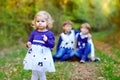 Portrait of three siblings children. Little cute toddler sister girl and Two kids brothers boys on background having fun Royalty Free Stock Photo