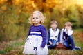 Portrait of three siblings children. Little cute toddler sister girl and Two kids brothers boys on background having fun Royalty Free Stock Photo