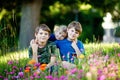 Portrait of three siblings children. Two kids brothers boys and little cute toddler sister girl having fun together on Royalty Free Stock Photo