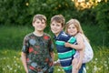 Portrait of three siblings children. Two kids brothers boys and little cute toddler sister girl having fun together on Royalty Free Stock Photo