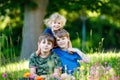 Portrait of three siblings children. Two kids brothers boys and little cute toddler sister girl having fun together on