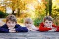 Portrait of three siblings children. Two kids brothers boys and little cute toddler sister girl having fun together in Royalty Free Stock Photo