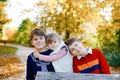 Portrait of three siblings children. Two kids brothers boys and little cute toddler sister girl having fun together in Royalty Free Stock Photo