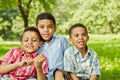 Portrait of three smiling boys-brothers who sit Royalty Free Stock Photo