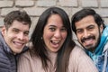 Portrait of three smiling friends looking at the camera Royalty Free Stock Photo