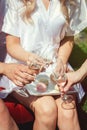 Portrait of three women wearing bathrobe clinking glasses with champagne during brides party Royalty Free Stock Photo