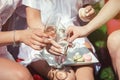 Portrait of three women wearing bathrobe clinking glasses with champagne during brides party Royalty Free Stock Photo