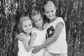 Portrait of three young cousins on willow Royalty Free Stock Photo