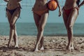 Portrait of Three Young Women in bikini Standing by a Volleyball Net on the beach Royalty Free Stock Photo