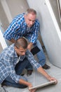 portrait tiler and apprentice