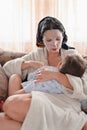 Portrait of a tired breast-feeding girl, with a moisturizing face mask Royalty Free Stock Photo