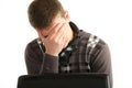 Portrait of tired businessman using laptop, eye fatigue