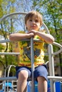 Portrait tired cute boy on the playground