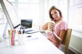 Portrait of tired graphic designer holding disposable coffee cup Royalty Free Stock Photo