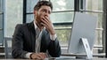 Portrait tired lazy napping yawn adult bearded man male manager worker bored at work project online in computer in
