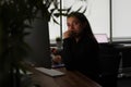 Portrait of tired pensive manager in dark office workplace