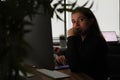 Portrait of tired pensive manager in dark office workplace