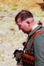 Portrait of a tired soldier-reenactor. Osovets battle reenactment