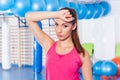 Portrait of tired woman having rest in short break after workout Royalty Free Stock Photo