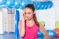 Portrait of tired woman having rest in short break after workout Royalty Free Stock Photo