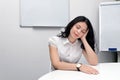 Overworked woman in meeting room