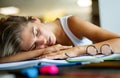 Portrait of tired young female studying in a library. Education study teenager concept Royalty Free Stock Photo