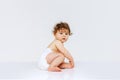 Portrait of toddler boy, baby in diaper isolated over white studio background. Family, happy childhood Royalty Free Stock Photo