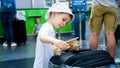 Portrait of little toddler boy playing with wooden airplane while waiting for flight in airport Royalty Free Stock Photo