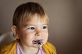 Portrait of toddler child with spider toy or candy. Halooween season activities