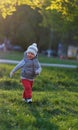 Toddler child in warm vest jacket outdoors. Baby boy at park. Royalty Free Stock Photo