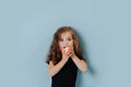 Portrait of toddler girl bites an apple