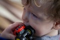 Portrait of toddler with red toy truck Royalty Free Stock Photo