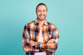 Portrait of toothy beaming guy with beard long hairdo wear flannel shirt arms folded smiling isolated on turquoise color Royalty Free Stock Photo