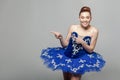 Portrait of toothy smiley beautiful ballerina woman in blue cost