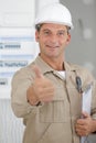 Portrait tradesman holding thumbs up