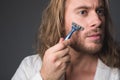 Cool man shaving his beard Royalty Free Stock Photo