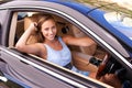 Portrait, travel and happy woman in sports car, driving or road trip with motor vehicle by window in Canada. Person Royalty Free Stock Photo