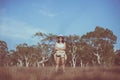 Portrait of traveler young asian woman standing and cross arm on sunset time in the summer forest,Happy and smiling,Relaxing time, Royalty Free Stock Photo