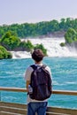 Portrait of traveler young boy in rhine falls in Switzerland Royalty Free Stock Photo